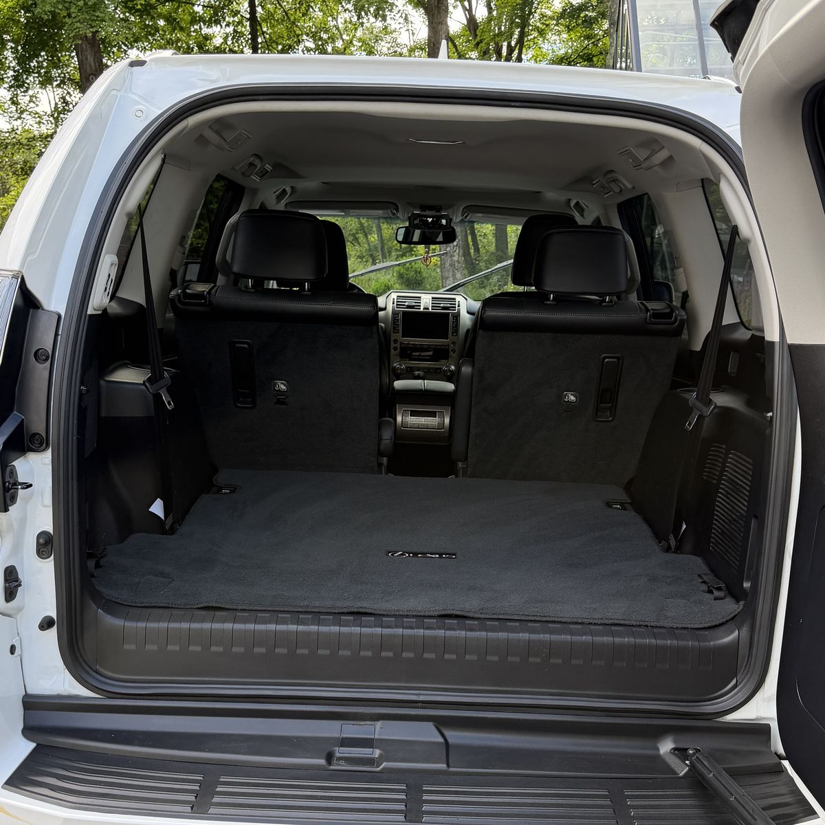 SUV cargo area after cleaning, carpet vacuumed and shampooed with the dirt and debris gone